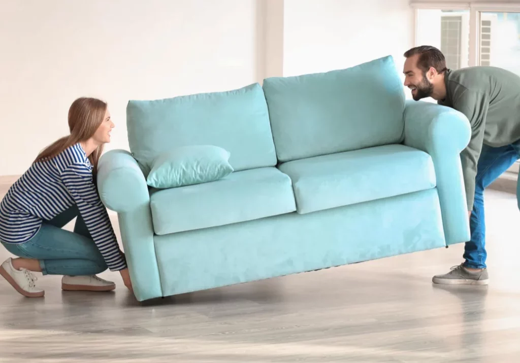 Couple Moving sofa | Jimmie Lyles Flooring Gallery